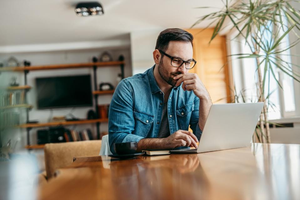 An Employee facing his laptop