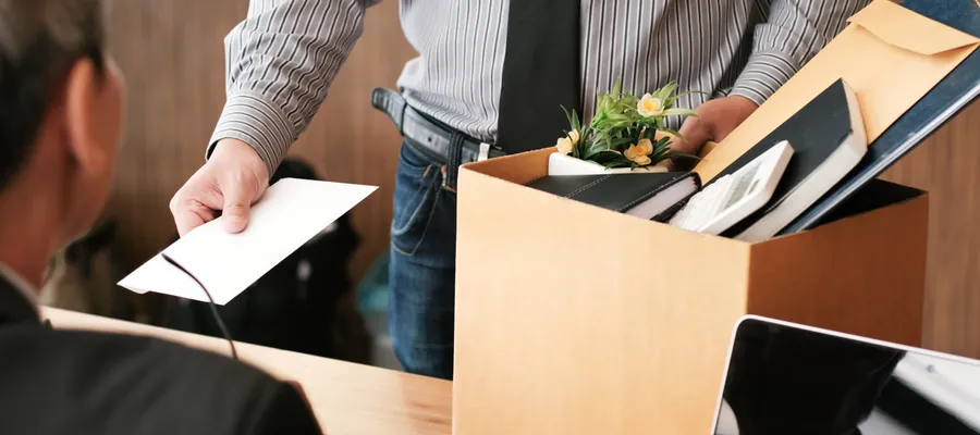 Man giving his boss resignation letter professionally